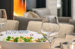 Enjoy a cozy dining experience with this inviting setup.
