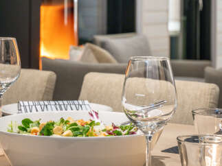 Enjoy a cozy dining experience with this inviting setup.