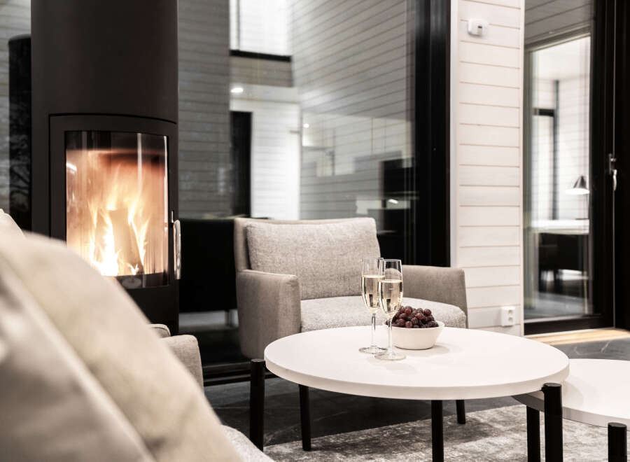 Cozy up in this modern living space, complete with a fireplace and comfortable seating.