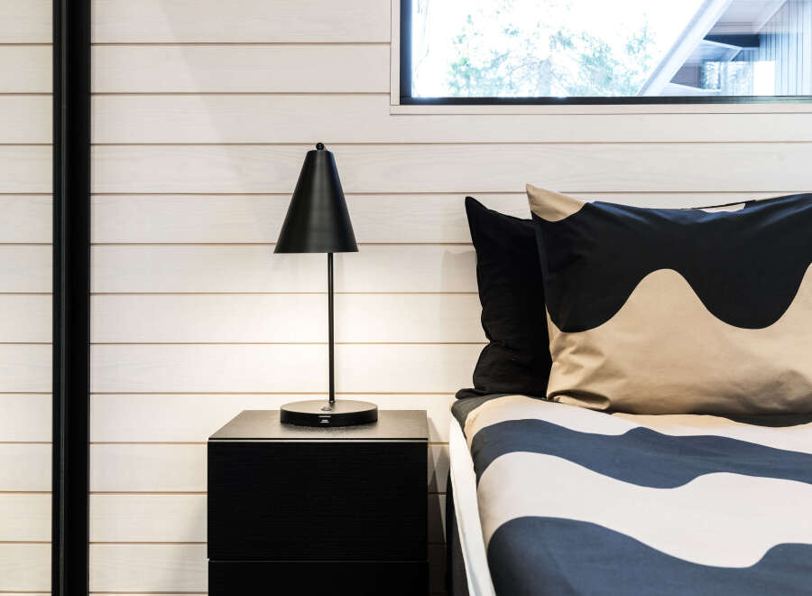 This bedroom features a modern design with a minimalist aesthetic.
