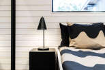 This bedroom features a modern design with a minimalist aesthetic.