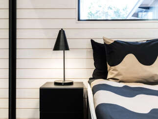 This bedroom features a modern design with a minimalist aesthetic.