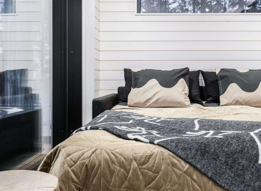 Cozy cabin bedroom with a modern design.