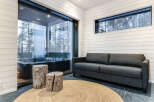 Relax in this luxurious space featuring a private hot tub and a cozy seating area.