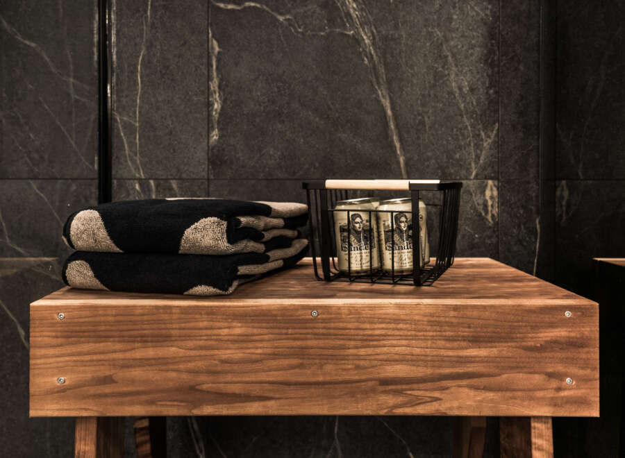 This luxurious bathroom features a sleek, modern design with dark marble accents.