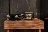 This luxurious bathroom features a sleek, modern design with dark marble accents.