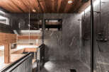 This luxurious bathroom features a stunning combination of wood and stone.