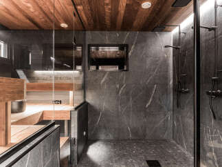 This luxurious bathroom features a stunning combination of wood and stone.