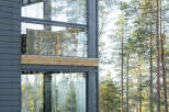 Experience modern luxury in this stunning glass-walled home.