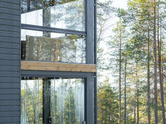 Experience modern luxury in this stunning glass-walled home.