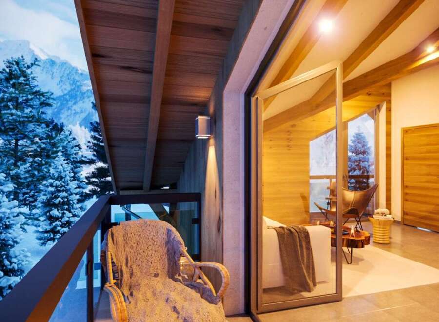Cozy balcony with mountain views, perfect for relaxing with a warm drink.