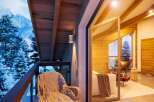 Cozy balcony with mountain views, perfect for relaxing with a warm drink.