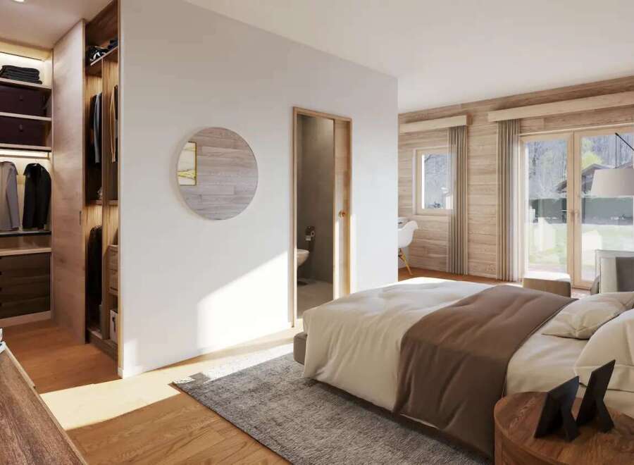This stunning bedroom boasts a walk-in closet and ensuite bathroom, perfect for a relaxing retreat.