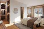 This stunning bedroom boasts a walk-in closet and ensuite bathroom, perfect for a relaxing retreat.