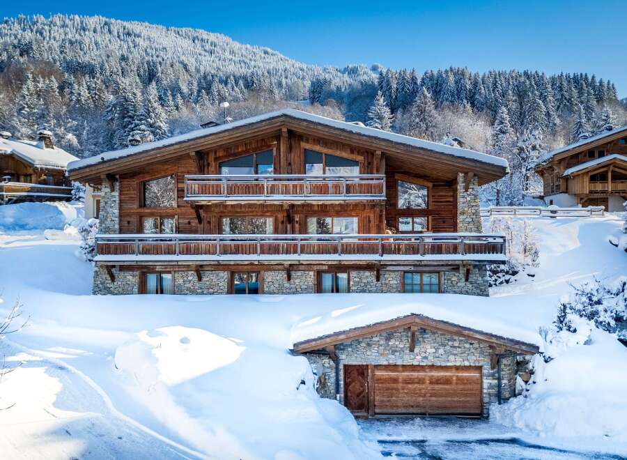 Experience the ultimate winter escape in this stunning chalet nestled amidst a snowy landscape.