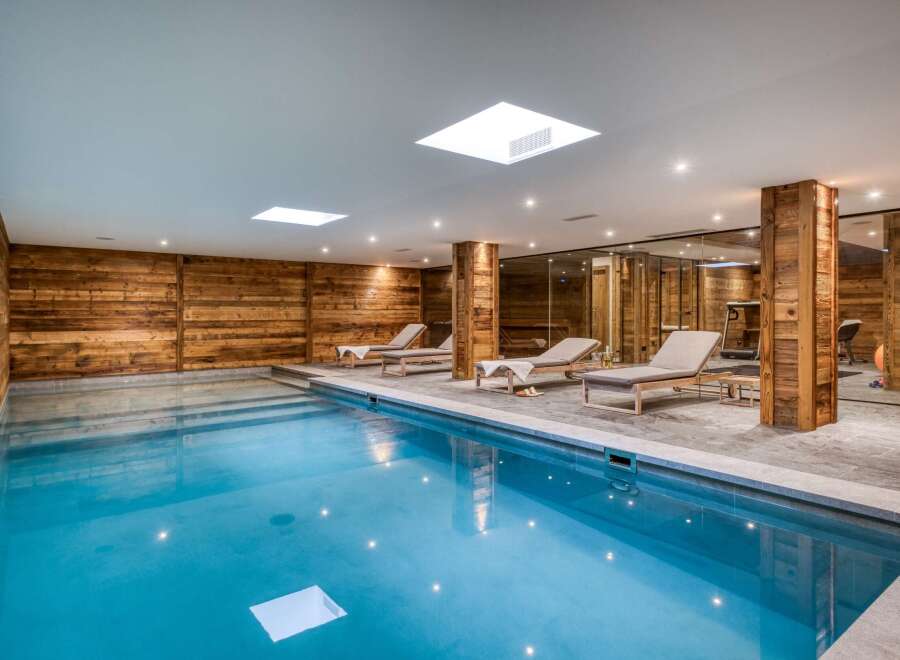 Indulge in luxury at this stunning indoor pool, featuring a serene ambiance and exquisite design.