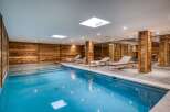Indulge in luxury at this stunning indoor pool, featuring a serene ambiance and exquisite design.