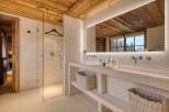 Experience luxury in this stunning bathroom featuring a sleek, modern design.