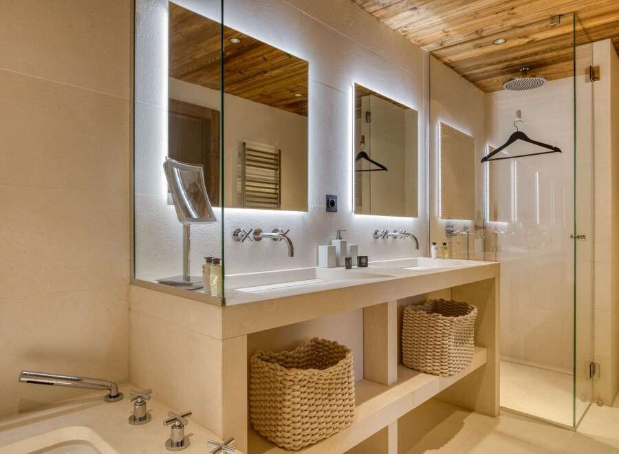 Indulge in the luxurious ambiance of this stunning bathroom.