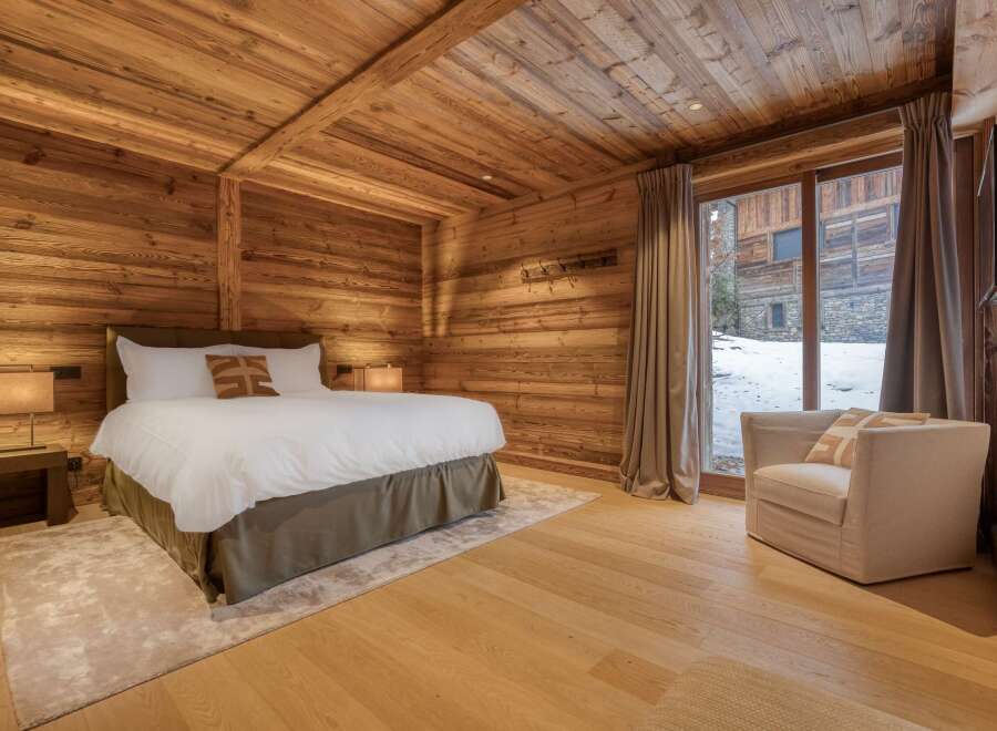 Experience rustic luxury in this stunning bedroom.