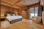 Experience rustic luxury in this stunning bedroom.