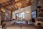 This stunning living room showcases a rustic yet modern design, perfect for a cozy mountain retreat.