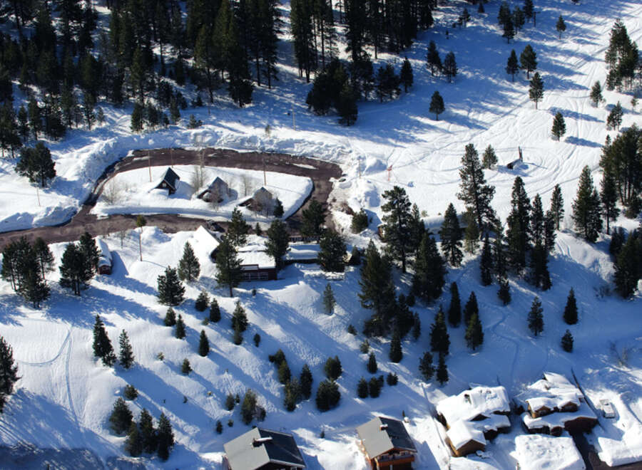 Nestled in a snowy mountainside, this charming property offers breathtaking views and serene surroundings.