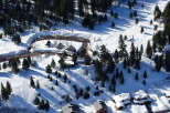 Nestled in a snowy mountainside, this charming property offers breathtaking views and serene surroundings.