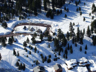 Nestled in a snowy mountainside, this charming property offers breathtaking views and serene surroundings.