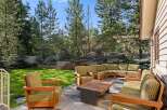 This stunning property boasts a spacious backyard with a beautifully landscaped lawn, providing a serene and private outdoor oasis.