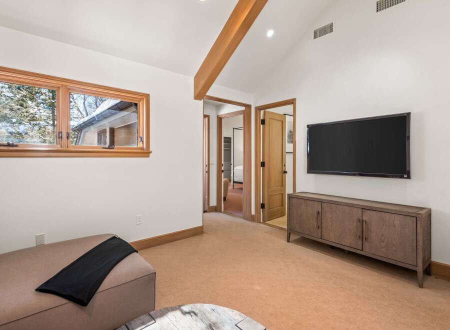 This stunning property boasts a spacious and bright living area with large windows offering breathtaking views.
