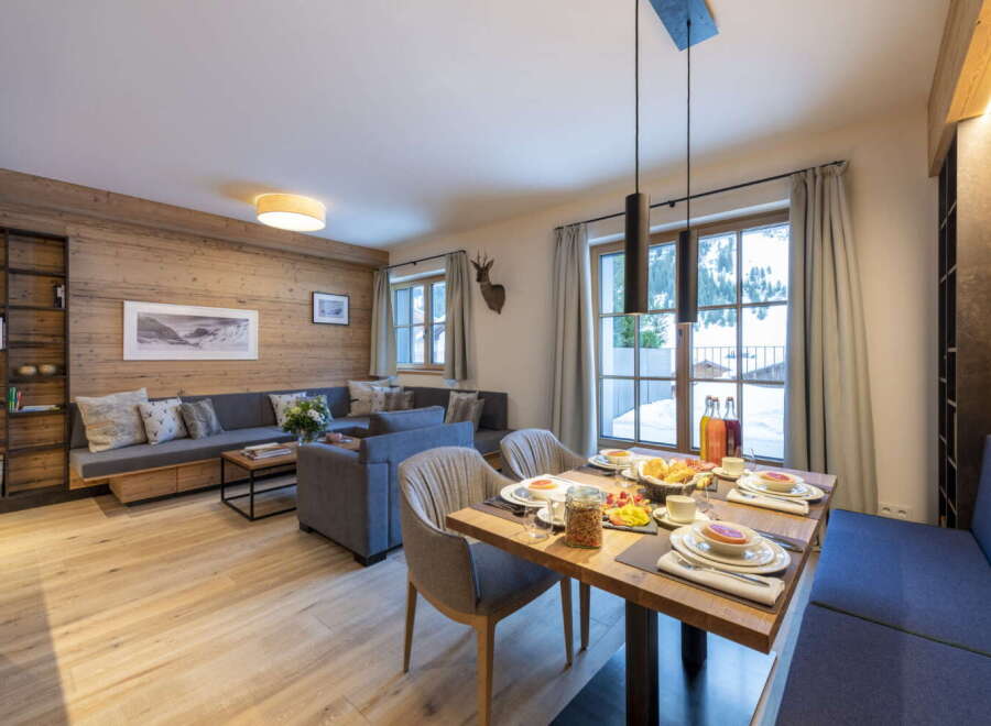 This stunning apartment boasts a spacious open-plan living area with floor-to-ceiling windows offering breathtaking views.