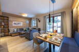 This stunning apartment boasts a spacious open-plan living area with floor-to-ceiling windows offering breathtaking views.