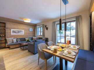 This stunning apartment boasts a spacious open-plan living area with floor-to-ceiling windows offering breathtaking views.