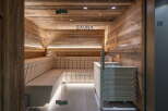 Indulge in tranquility within this exquisitely designed sauna, showcasing rustic wooden walls and sleek modern features.