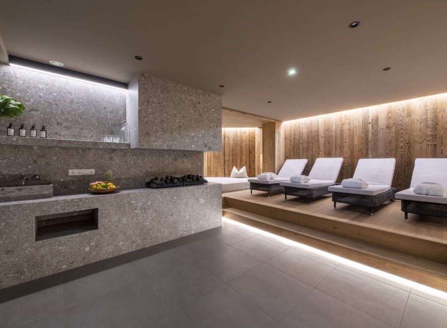 Relax and rejuvenate in our luxurious spa, featuring a tranquil relaxation area with comfortable loungers and a sleek, modern design.