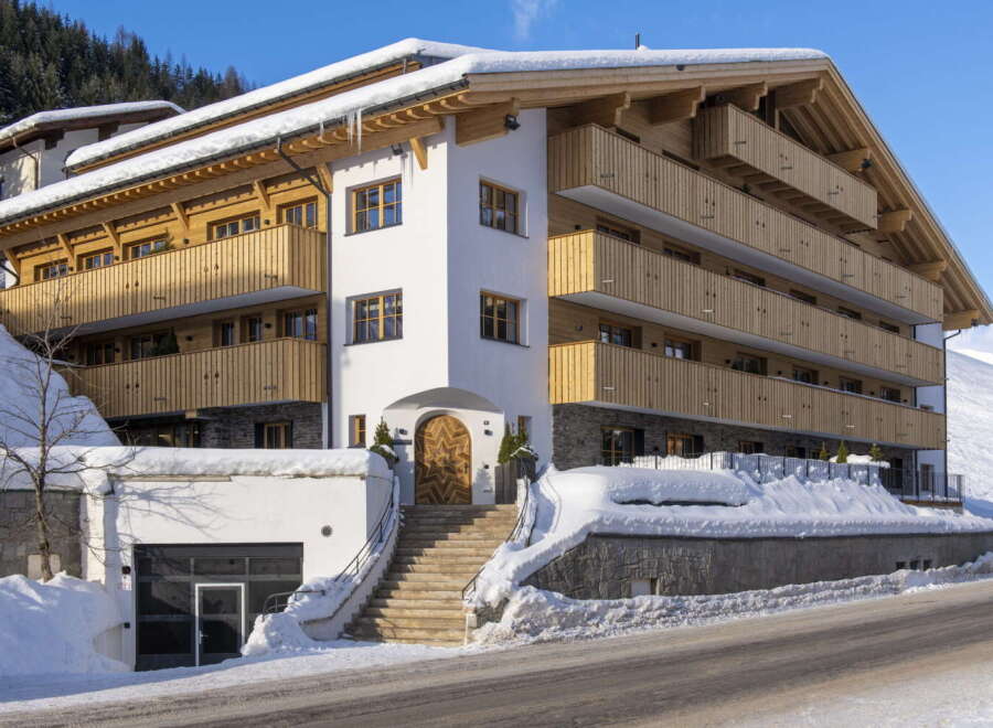 This stunning chalet boasts multiple levels with private balconies, offering breathtaking mountain views.