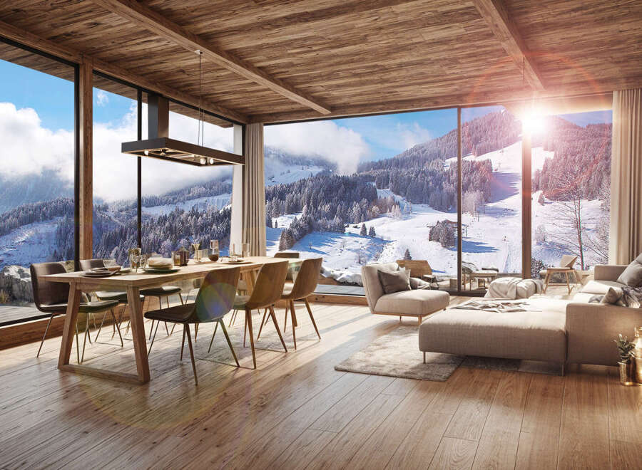 This stunning chalet boasts breathtaking panoramic views of a snow-covered mountain range, visible through expansive floor-to-ceiling windows.