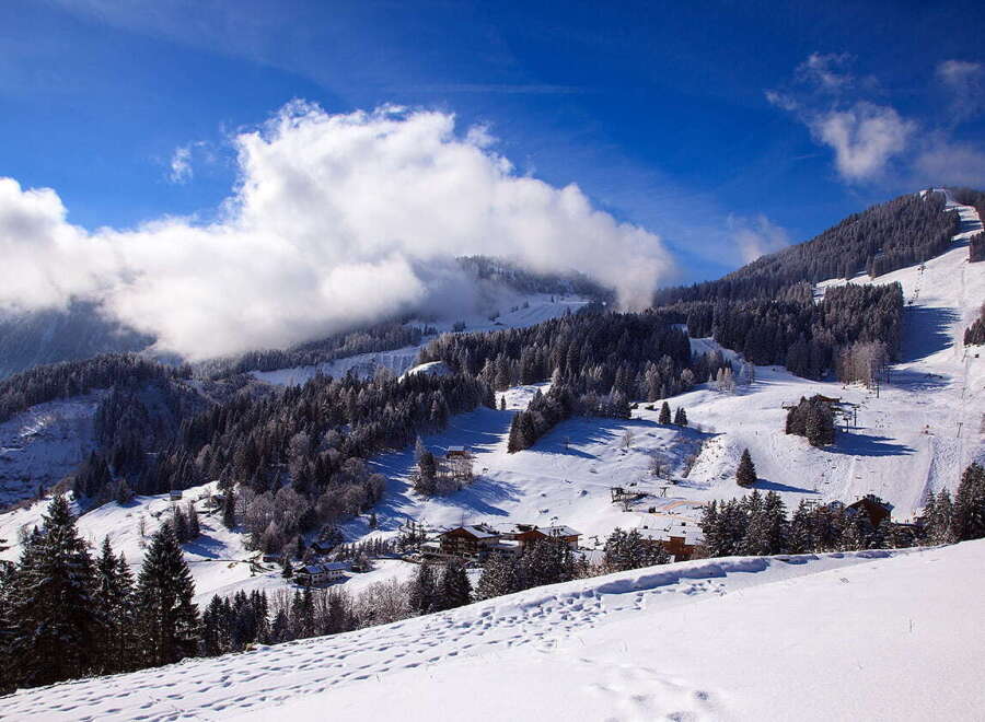 Nestled in a breathtaking snowy mountain range, this idyllic ski resort offers stunning views and pristine slopes.