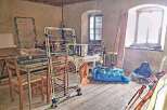 This property features a spacious room with ample natural light from large windows.
