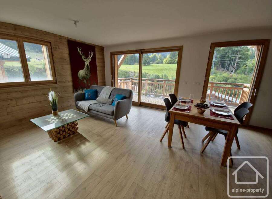 Discover the charm of this stunning property, featuring a cozy living area with a comfortable sofa and a unique coffee table.