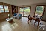 Discover the charm of this stunning property, featuring a cozy living area with a comfortable sofa and a unique coffee table.