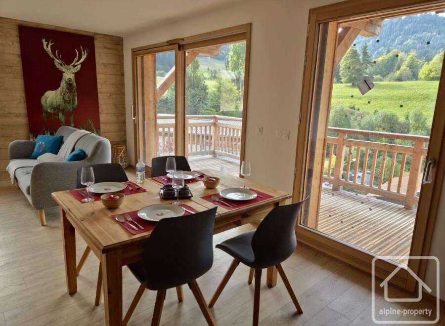 Experience the charm of this stunning property, featuring a beautifully furnished dining area perfect for gatherings.