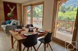 Experience the charm of this stunning property, featuring a beautifully furnished dining area perfect for gatherings.