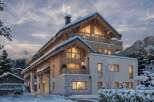 Luxury chalet in the snowy mountains with stunning views.