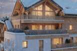 Luxury chalet apartment in a stunning snowy setting.