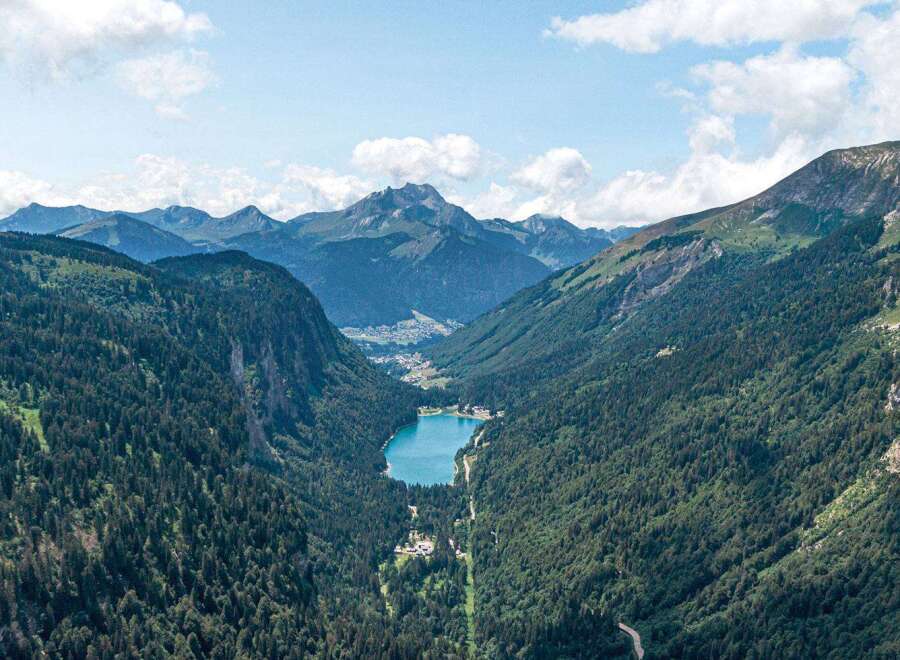 Nestled in a pristine mountain valley, this breathtaking property boasts stunning views of a crystal-clear lake and majestic peaks.