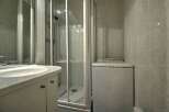 This charming apartment boasts a modern bathroom with a shower and a convenient in-unit washer.