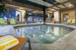 This luxurious hotel boasts a stunning indoor pool and jacuzzi area, perfect for relaxation and rejuvenation.