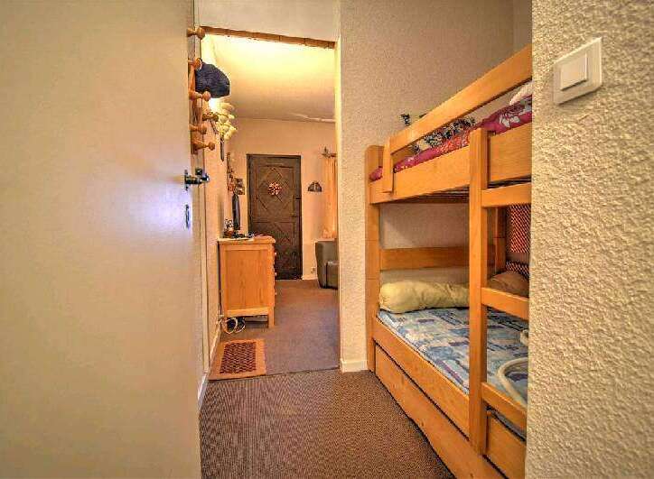 Cozy bunk beds in a charming hallway, perfect for a family getaway.